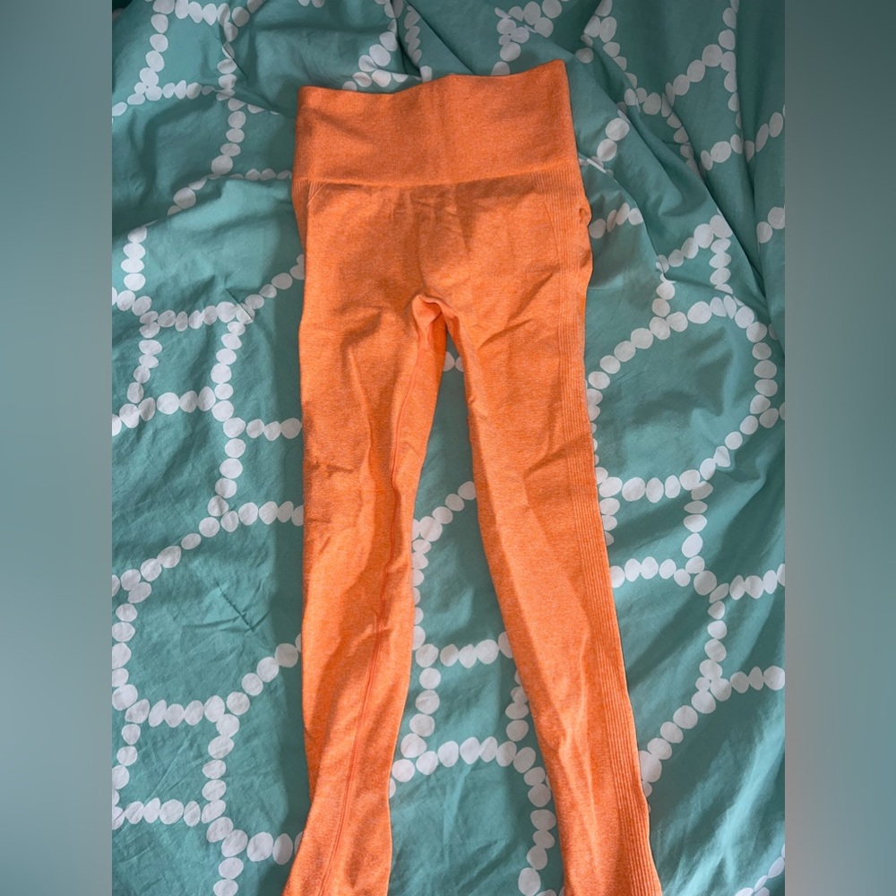 Never worn- orange seamless legging with booty contour